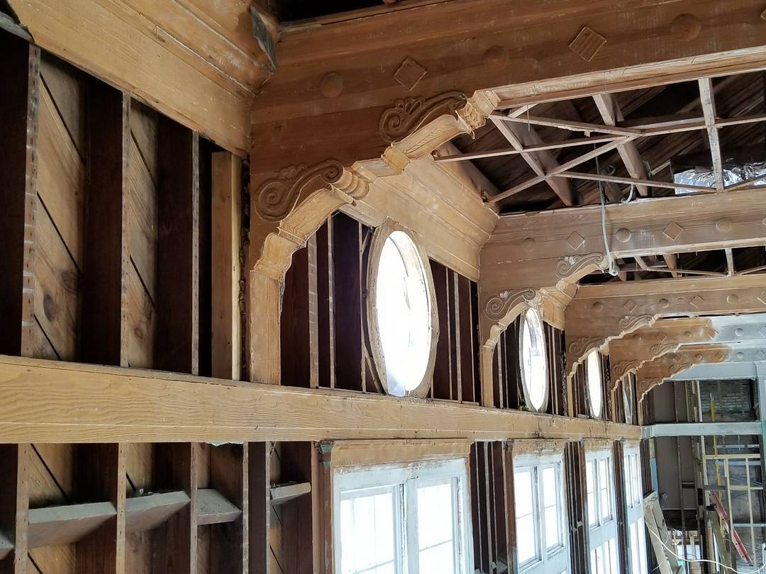 Historic framing exposed inside Mill Hill Auditorium