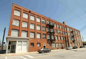 Four-story brick Happ Brothers factory building, now Broadway Lofts