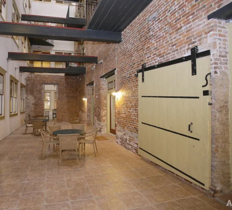 Interior courtyard with preserved freight door at Broadway Lofts
