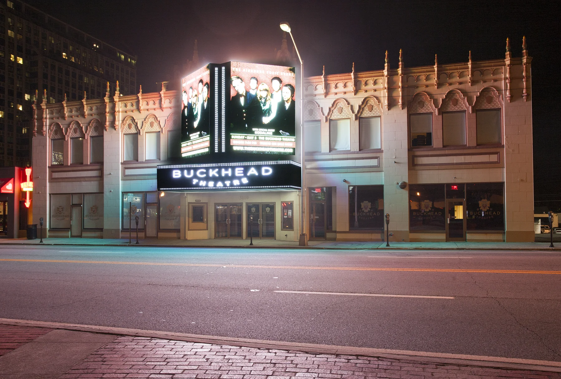 Buckhead Theatre marquee and restored Spanish Revival facade at night