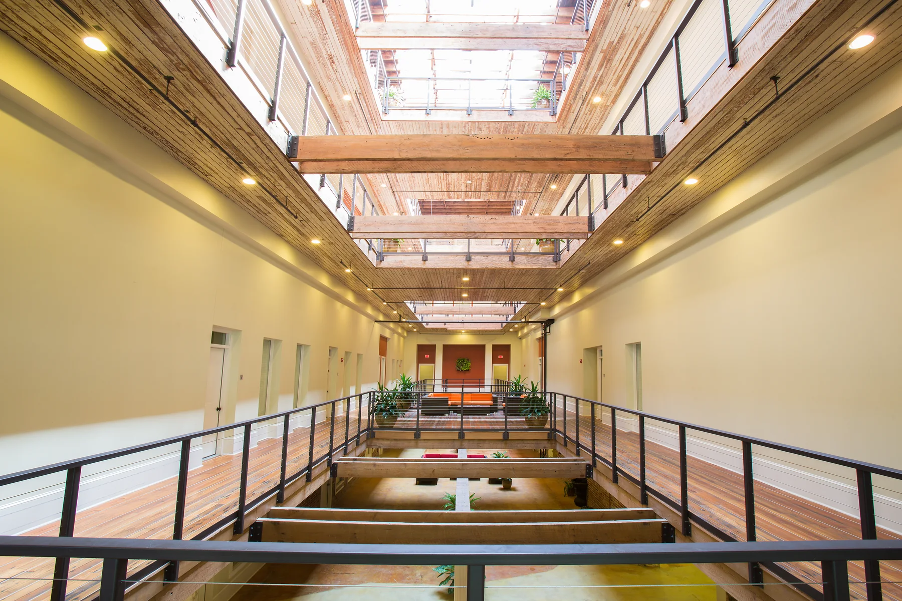 Skylit multistory atrium at Dannenberg Lofts