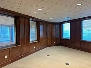 Wood-paneled corner office in available Suite 201