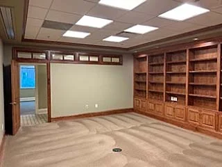 Conference room with built-in shelving in Suite 201