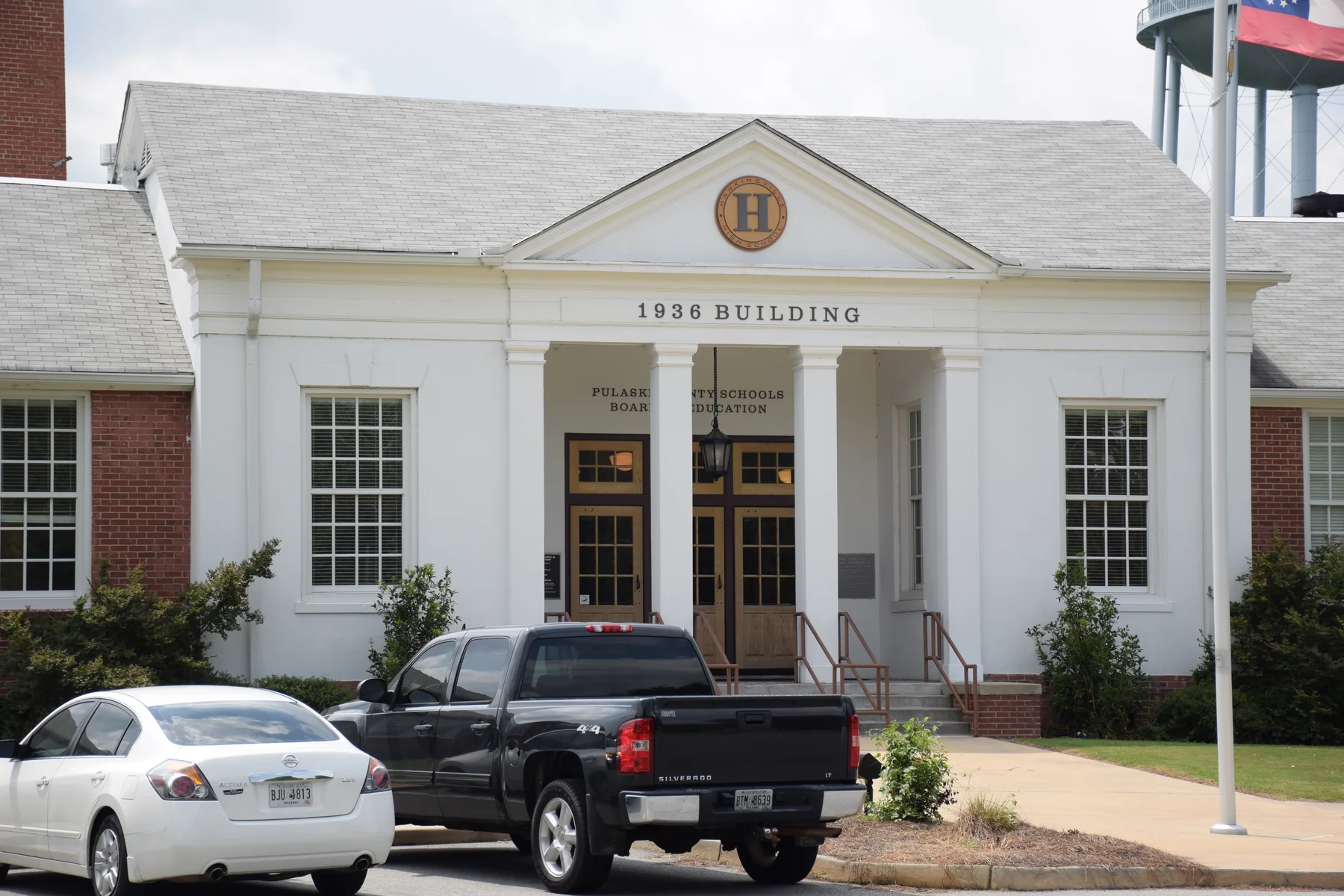 Brick facade and columned entrance of the 1936 Hawkinsville Public School