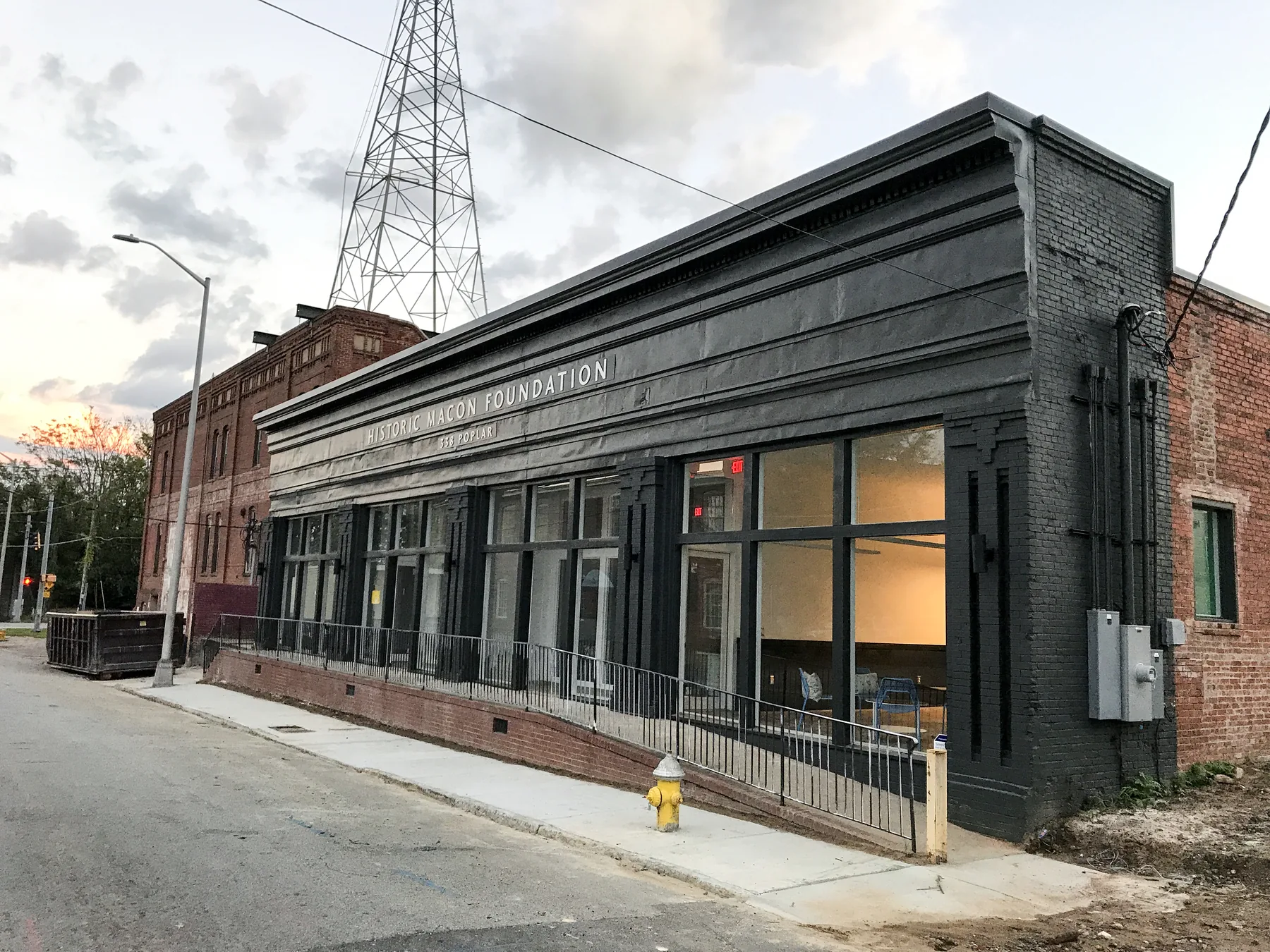 Black-painted brick storefront occupied by Historic Macon Foundation