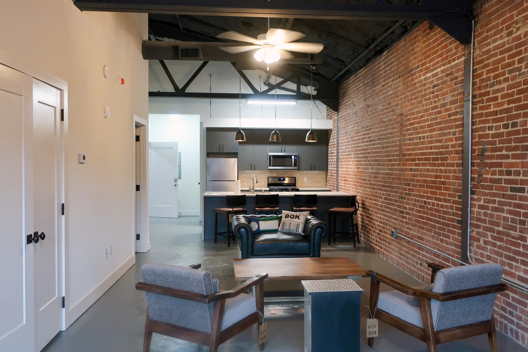Exposed-brick living space inside Liberty Lofts