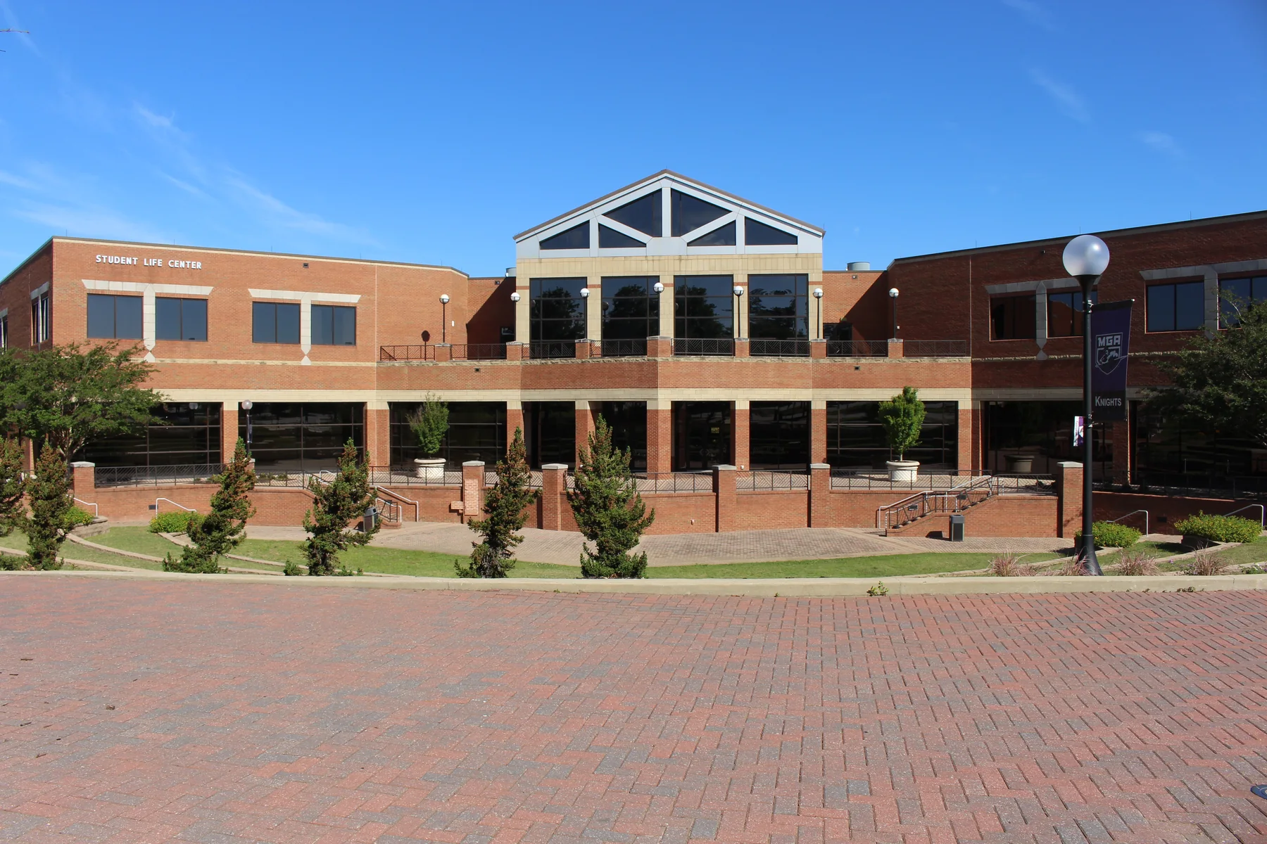 Brick Student Life Center with a curved glass entrance on the Macon campus
