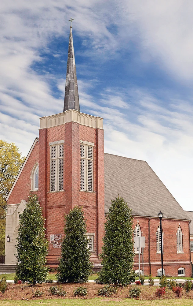 Restored brick church exterior and spire of the Tattnall Center