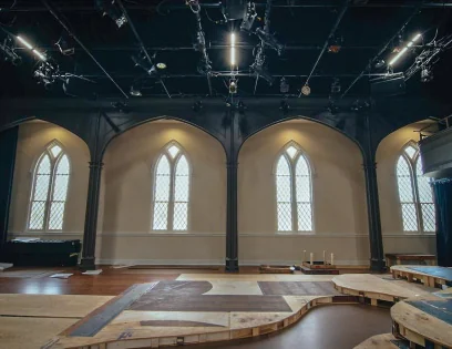 Flexible theater space under stage lighting at the Tattnall Center